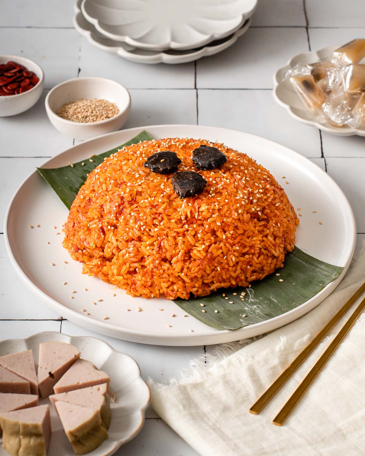 A plate of xoi gac Vietnamese red sticky rice.
