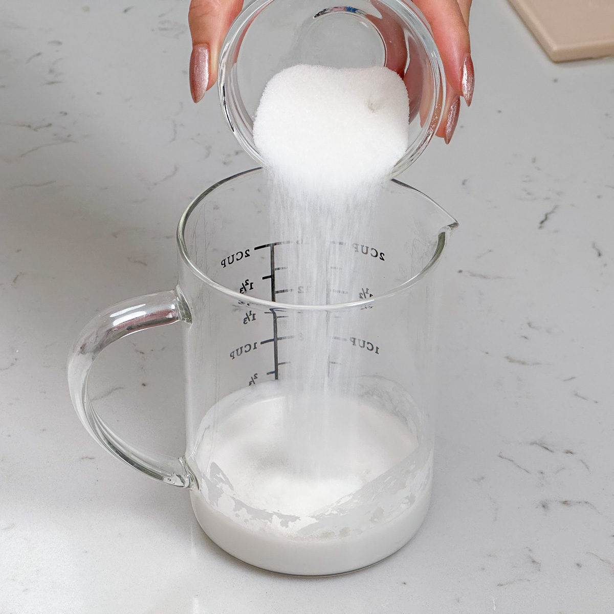 Add sugar to the coconut milk to sweeten it.