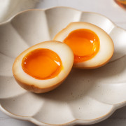 A ramen egg sliced in half after being marinated.