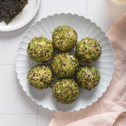 Several korean rice balls on a plate ready to be served.