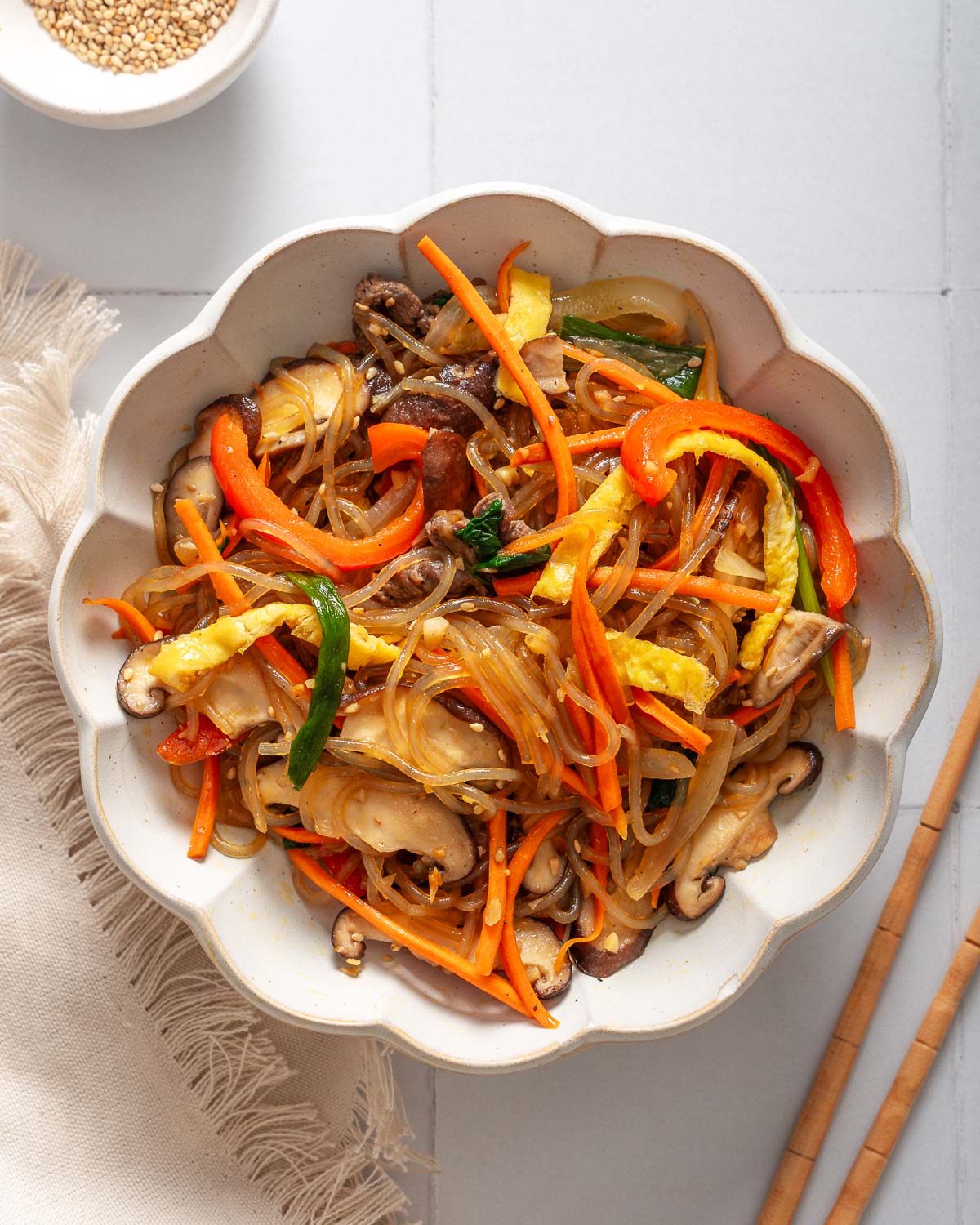 Looking down at a bowl of japchae noodles.