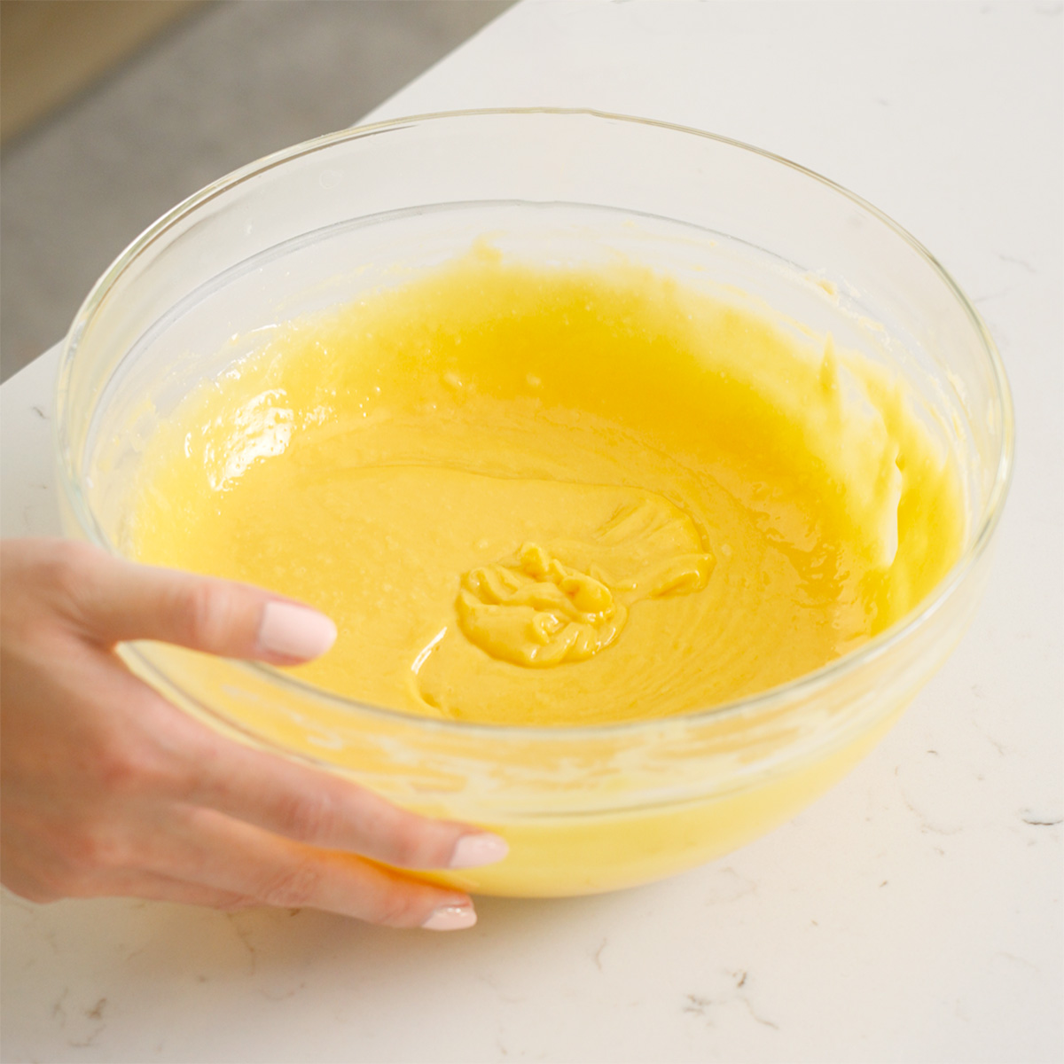 Egg yolks combined with a flour mixture for making a cake batter.