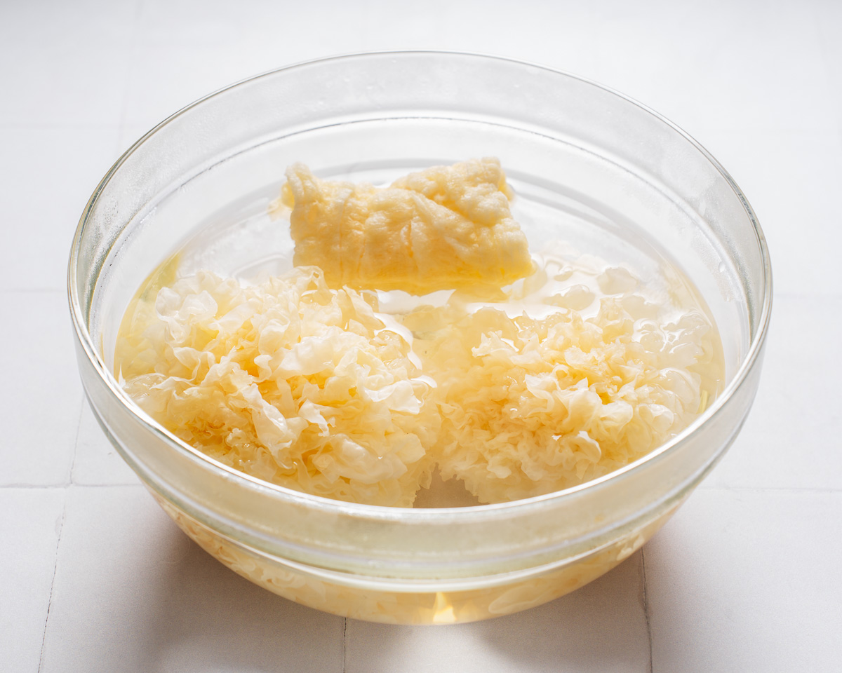 Rehydrating white fungus in a bowl of hot water.