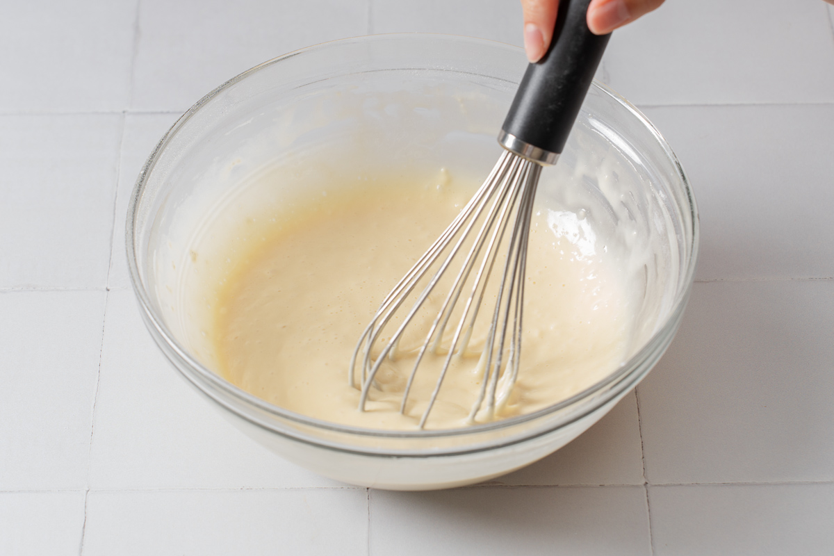 Whisking together the wet ingredients for making taiyaki.