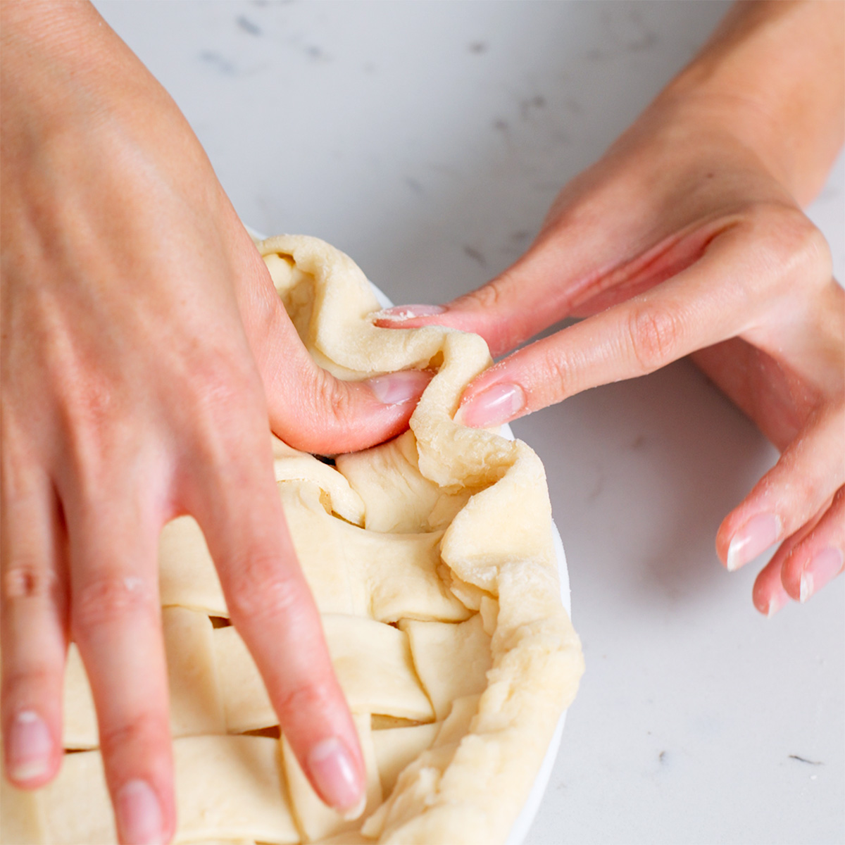 Creating a wavy crust pattern with the finger technique.