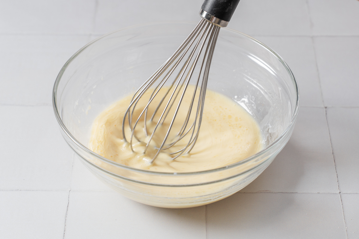 Taiyaki batter whisked together in a bowl.