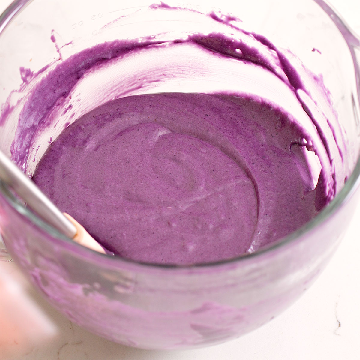 An ube and chocolate mixture blended together.