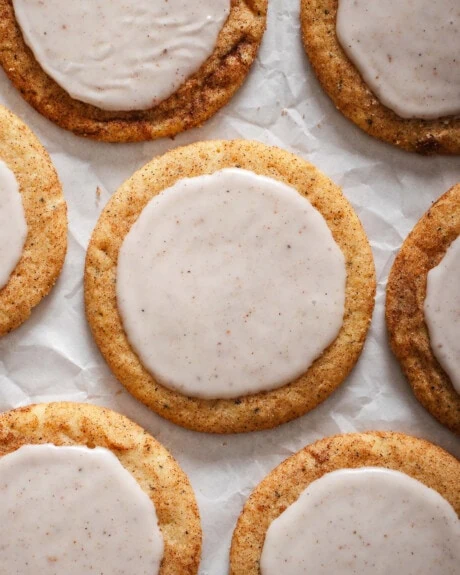 Looking down at a grid of Chai sugar cookies on parchment paper.