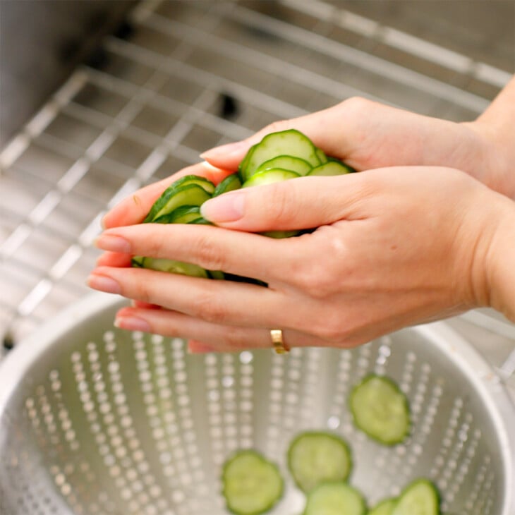 Squeezing water out of Japanese cucumbers