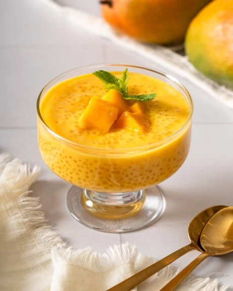 A portrait of a dessert bowl with mango sago.