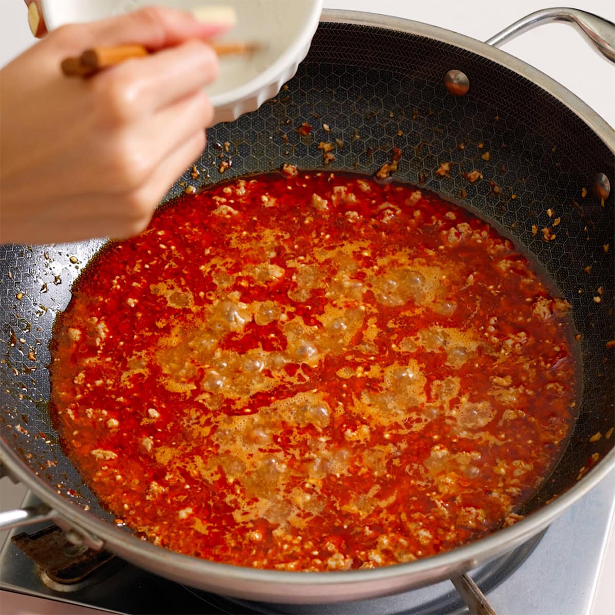 Pork sauce boiling before being thickened.