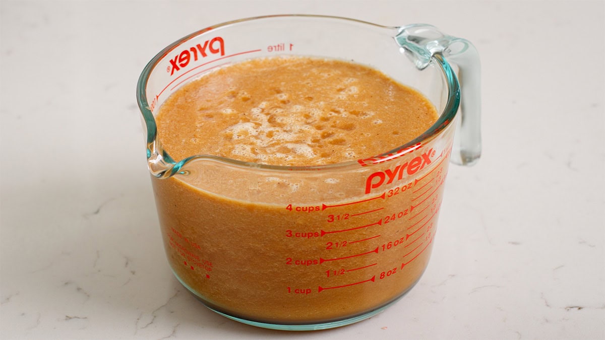 Blended braising sauce in a large measuring bowl.