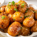 A detail shot of a bowl of Korean braised potatoes.