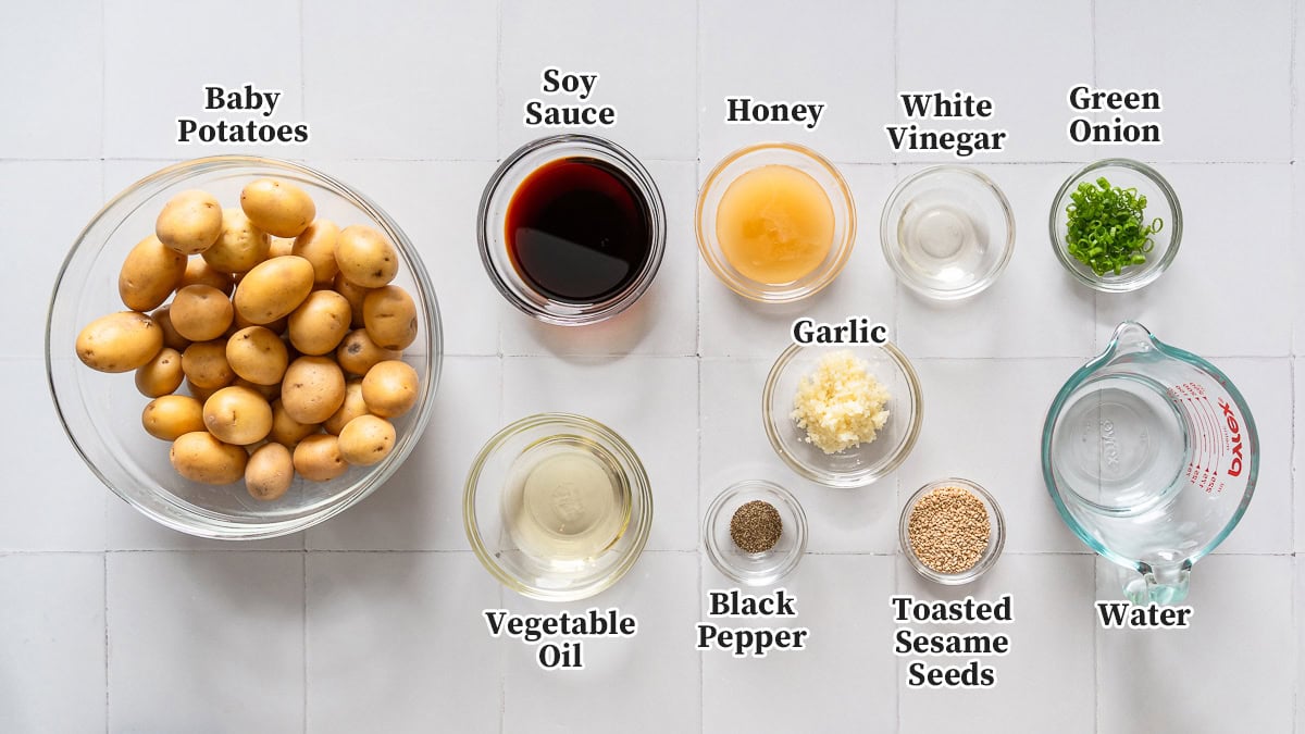 All the ingredients for Korean braised potatoes organized in bowls and labeled.