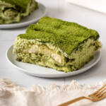 A slice of matcha tiramisu on a plate.