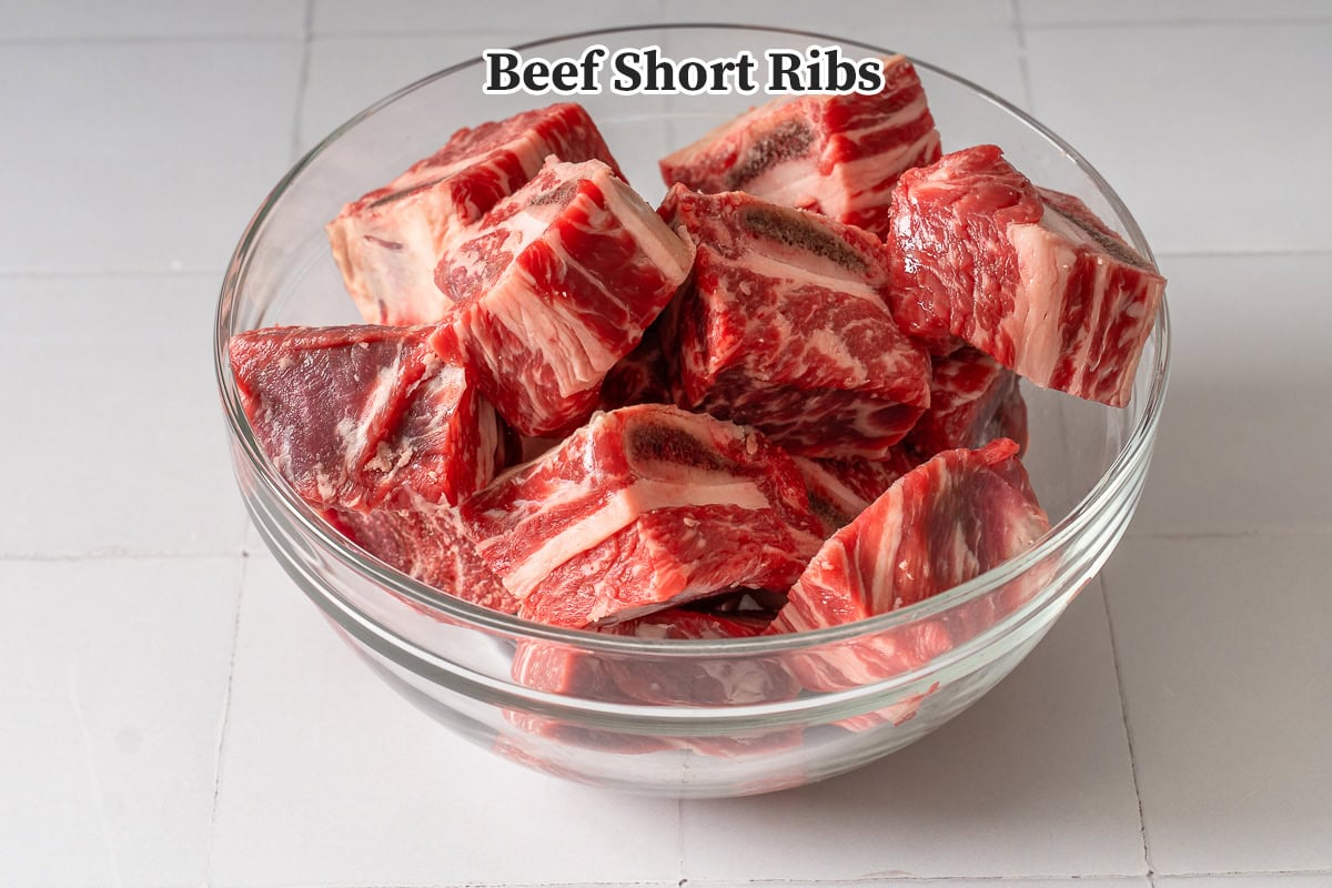 A large bowl of beef short ribs.