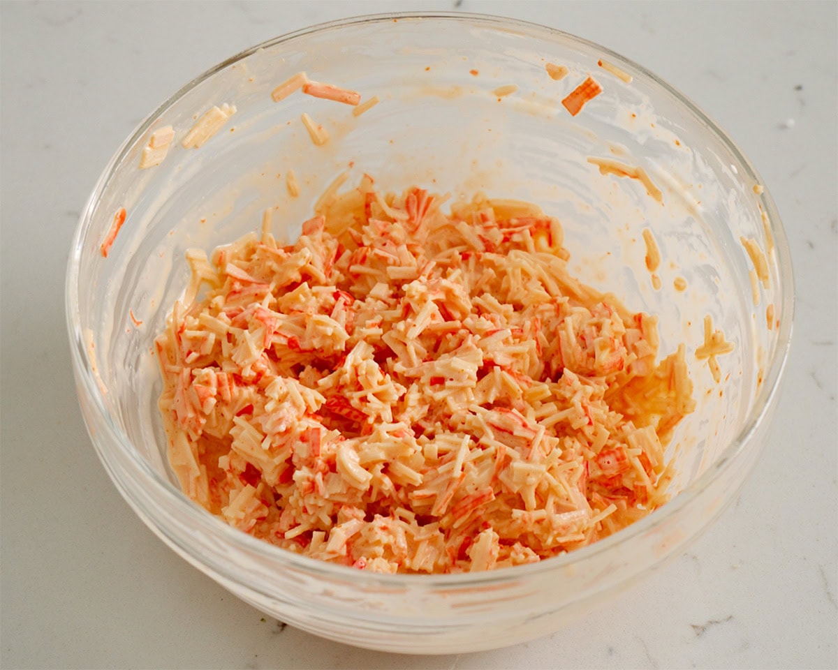 Spicy crab filling mixed together in a bowl.