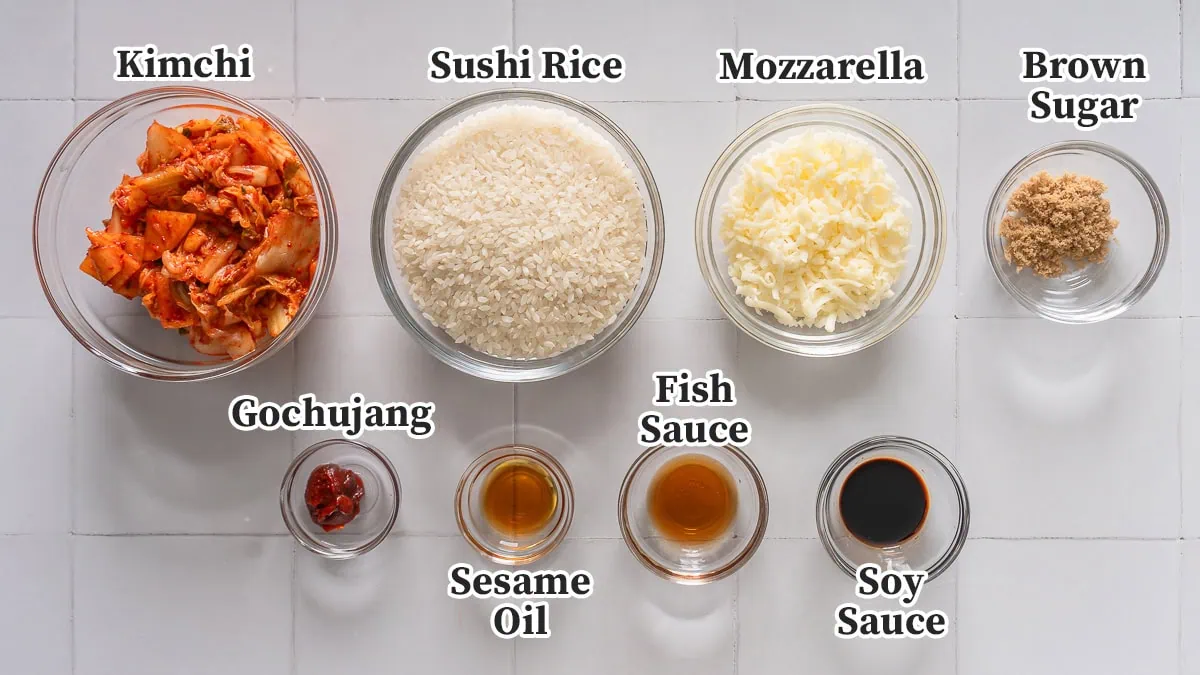 All the ingredients to make kimchi rice balls labeled and organized.