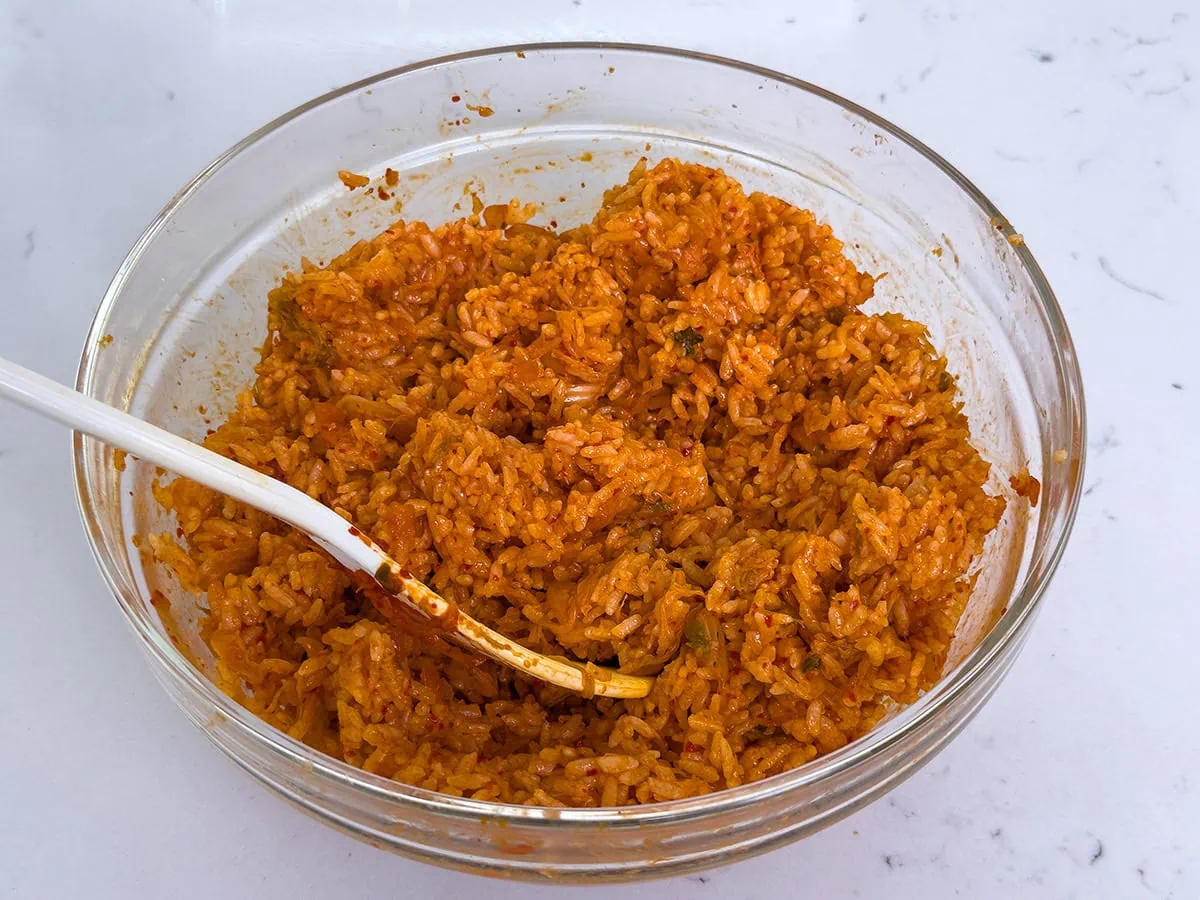 kimchi sushi rice mixed together in a large bowl.