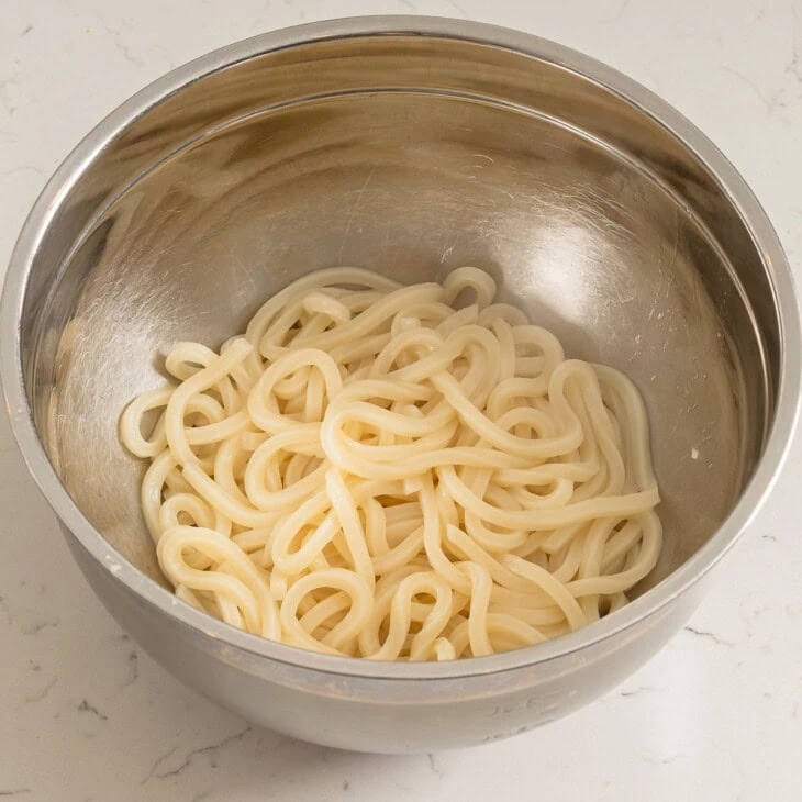 Udon noodles in a large bowl.