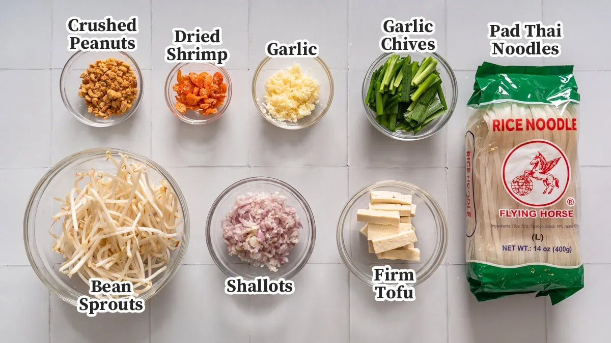 All the ingredients for pad thai labeled and organized.