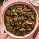 A topdown view of a plate of beef and broccoli.