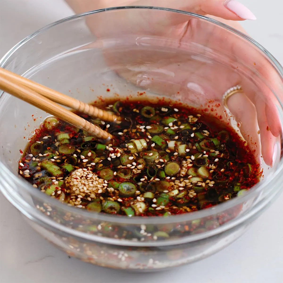 Mixing together the sauce for Korean braised tofu.